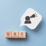 For User Generated Content Concept.(ugc) Online Marketing. Customer Create Content On Social Media . Wooden Cube Blocks With Ugc Text And Abbreviation , White Speech Bubble Paper With Icon