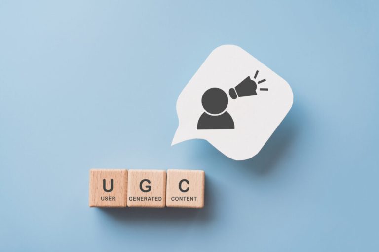 For User Generated Content Concept.(ugc) Online Marketing. Customer Create Content On Social Media . Wooden Cube Blocks With Ugc Text And Abbreviation , White Speech Bubble Paper With Icon